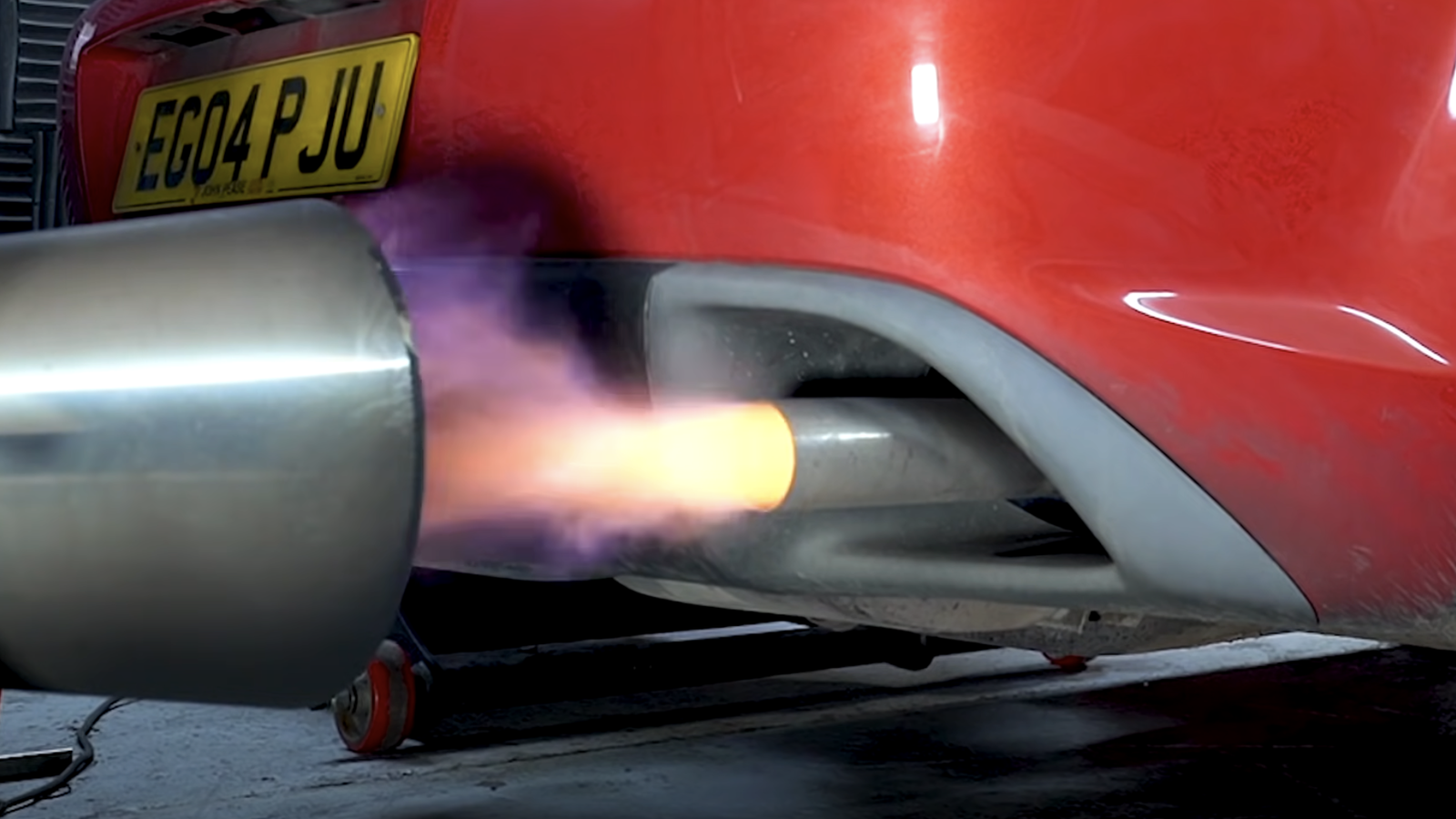 A Mazda RX-8 exhaust spitting flames